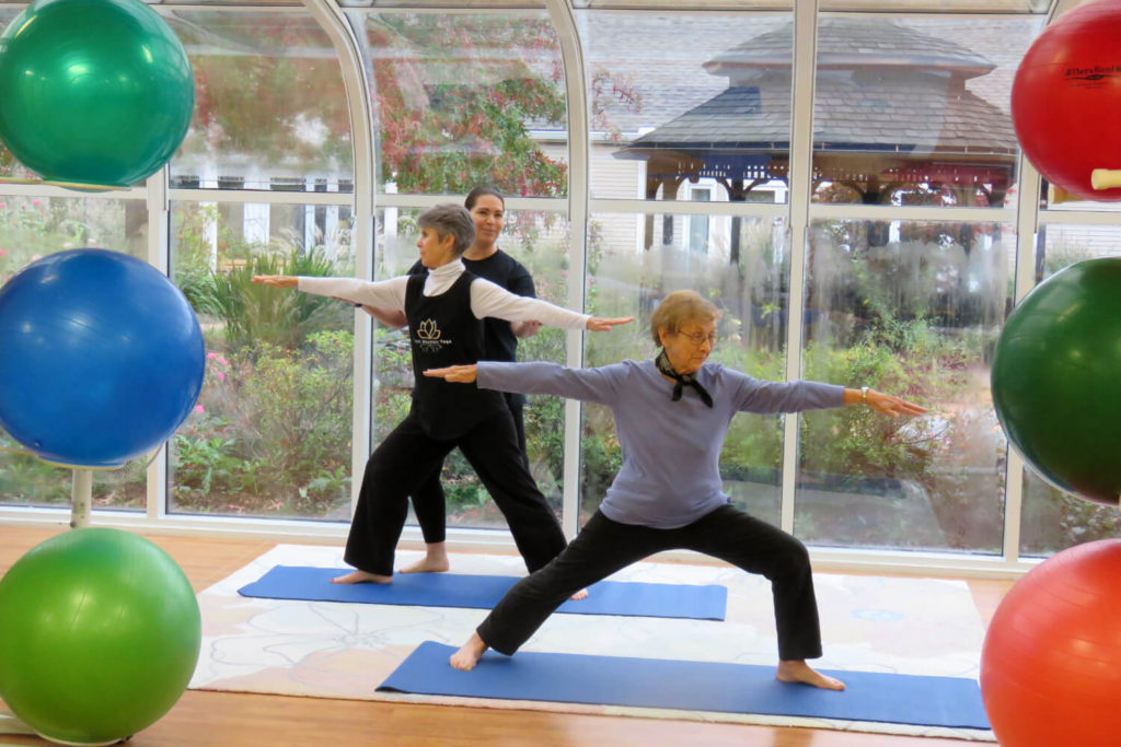two woman doing yoga 