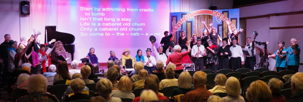 group of people on stage performing 