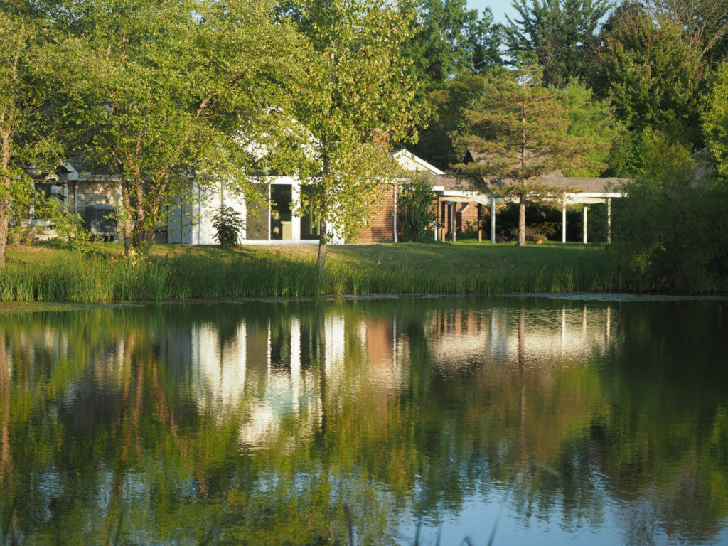 cottage and pond with cottage reflection 