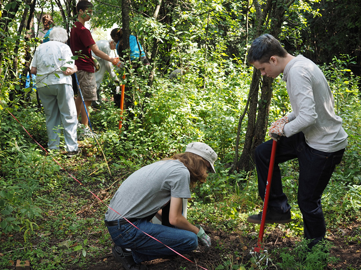 Student volunteers work with residents