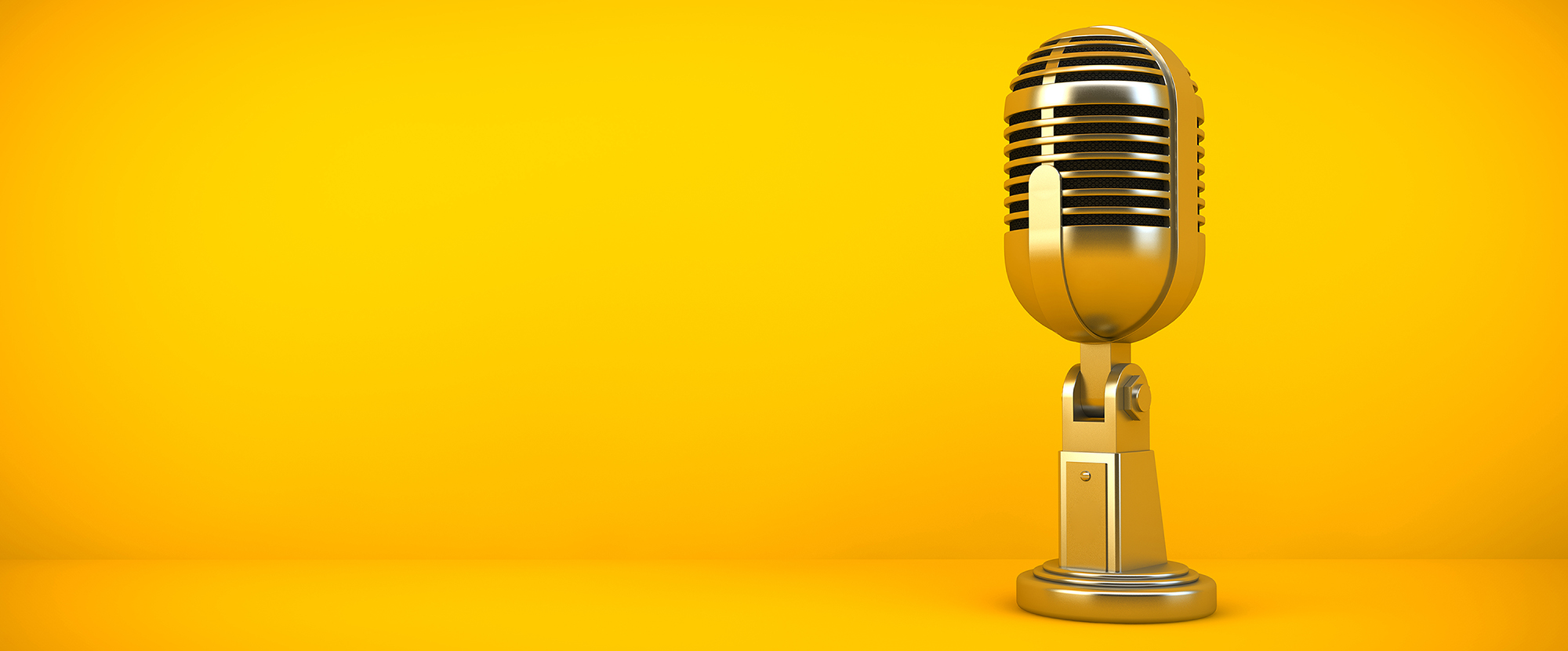 gold microphone on yellow background