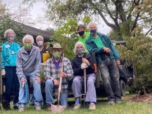 group of masked residents and staff gardeners