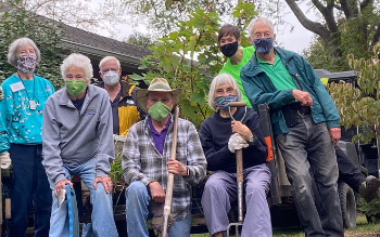 group of masked residents and staff gardeners
