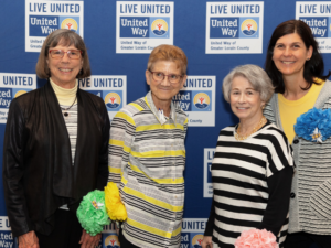 four woman standing together