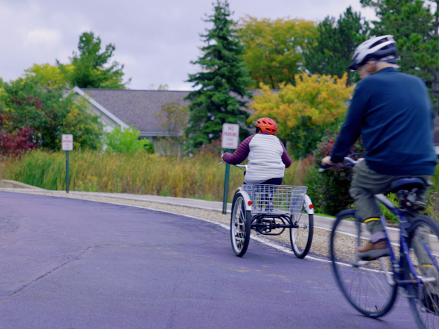 two people riding bikes 