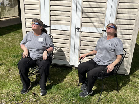 Housekeeping staff watch the 2024 eclipse