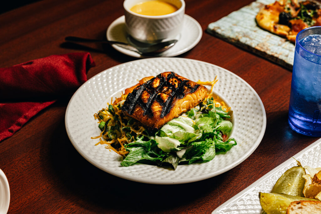 plated salad with salmon on top