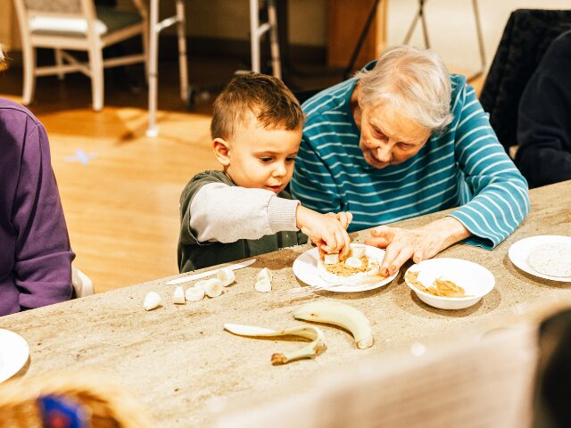 woman and child making a snack