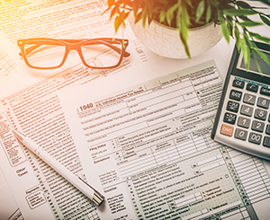 Tax forms. glasses and calculator