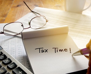 note being written saying tax time