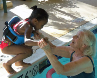 older-adult-and-child-in-pool