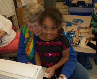 older-adult-helping-sew.jpg